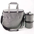 Load image into Gallery viewer, Gray waterproof pet travel bag with spacious compartments and detachable food container for stress-free outings.
