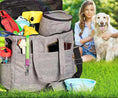 Load image into Gallery viewer, Pet travel bag with organized compartments beside a woman and her golden retriever in a grassy outdoor setting.
