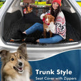 Load image into Gallery viewer, Woman with a dog sitting on a trunk-style seat cover with zippers in a car, designed for pet protection and comfort.
