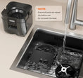 Load image into Gallery viewer, Smart pet feeder components being rinsed in a kitchen sink with water running, highlighting maintenance instructions.
