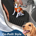 Load image into Gallery viewer, Beagle sitting on a 5-in-1 waterproof dog car seat cover in a stylish car interior, showcasing co-pilot style for pets.
